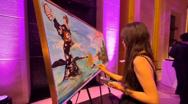 Artist Ada Zhang demonstrates Chinese painting styles at the Sands Resort Macao dinner at the Mandarin Oriental Tokyo